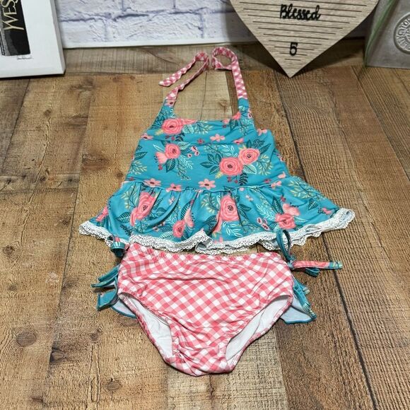 Oopsie daisy two
Piece swimsuit ruffle size 4 - Picture 9 of 10